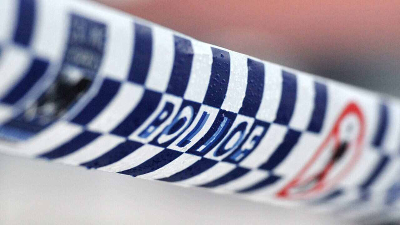 Police tape restricts access to a crime scene