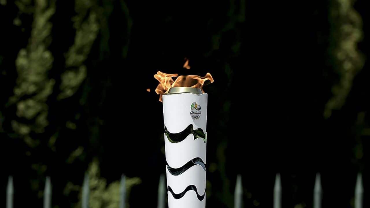 The Olympic Flame burns on a torch during the torch relay in Greece.