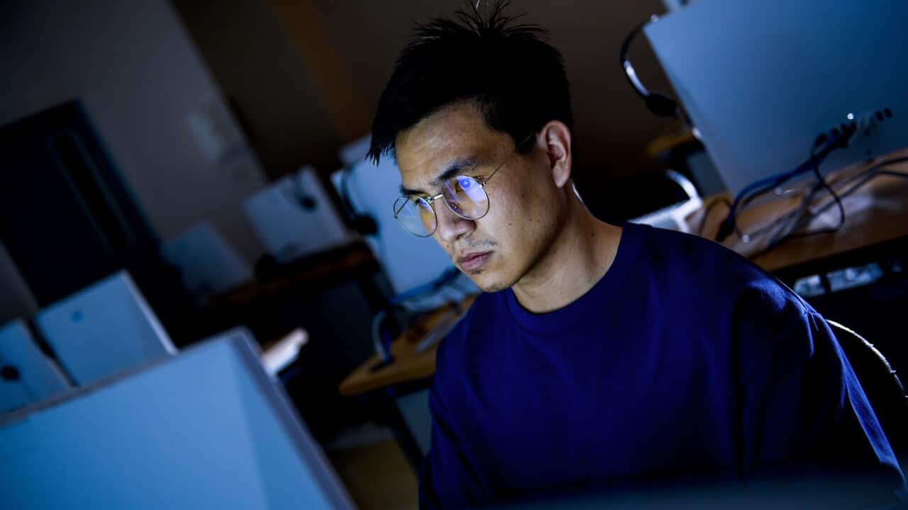 Computer hacker stealing information with computer