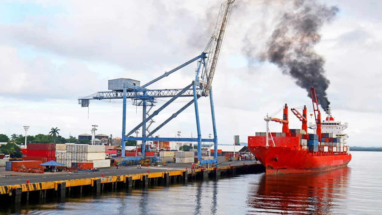 Freighter Spewing Black smoke pollution at port. Corinto, Nicaragua.  Marine Pollution.