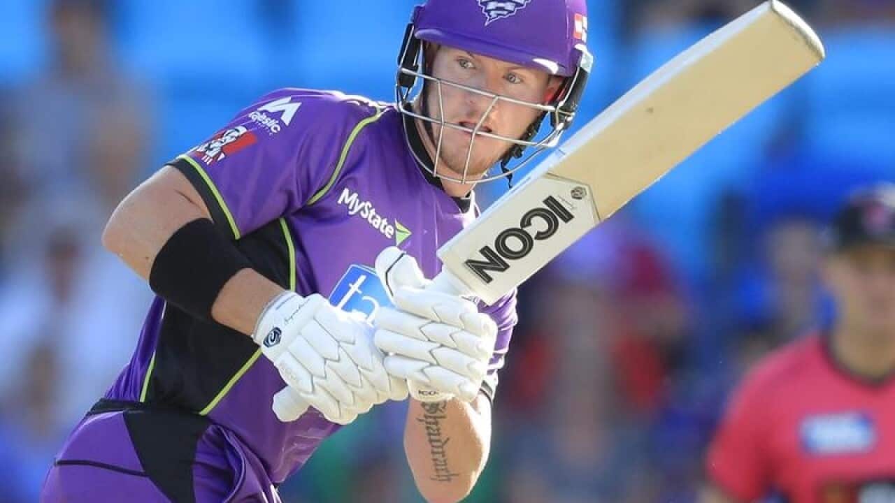 D'Arcy Short of the Hurricanes plays a shot.