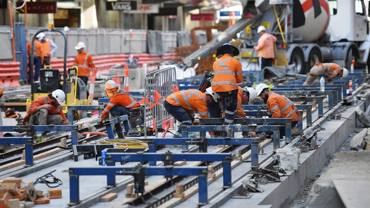 Workers are seen on the George St, Sydney CBD Light Rail Project construction in Sydney, Tuesday, October 10, 2017.
