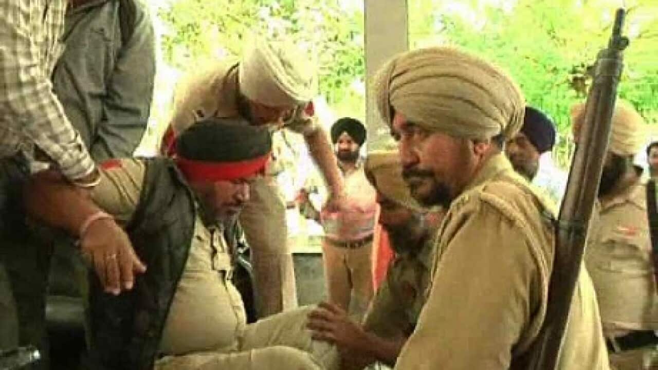 Unconscious policemen being taken to hospital