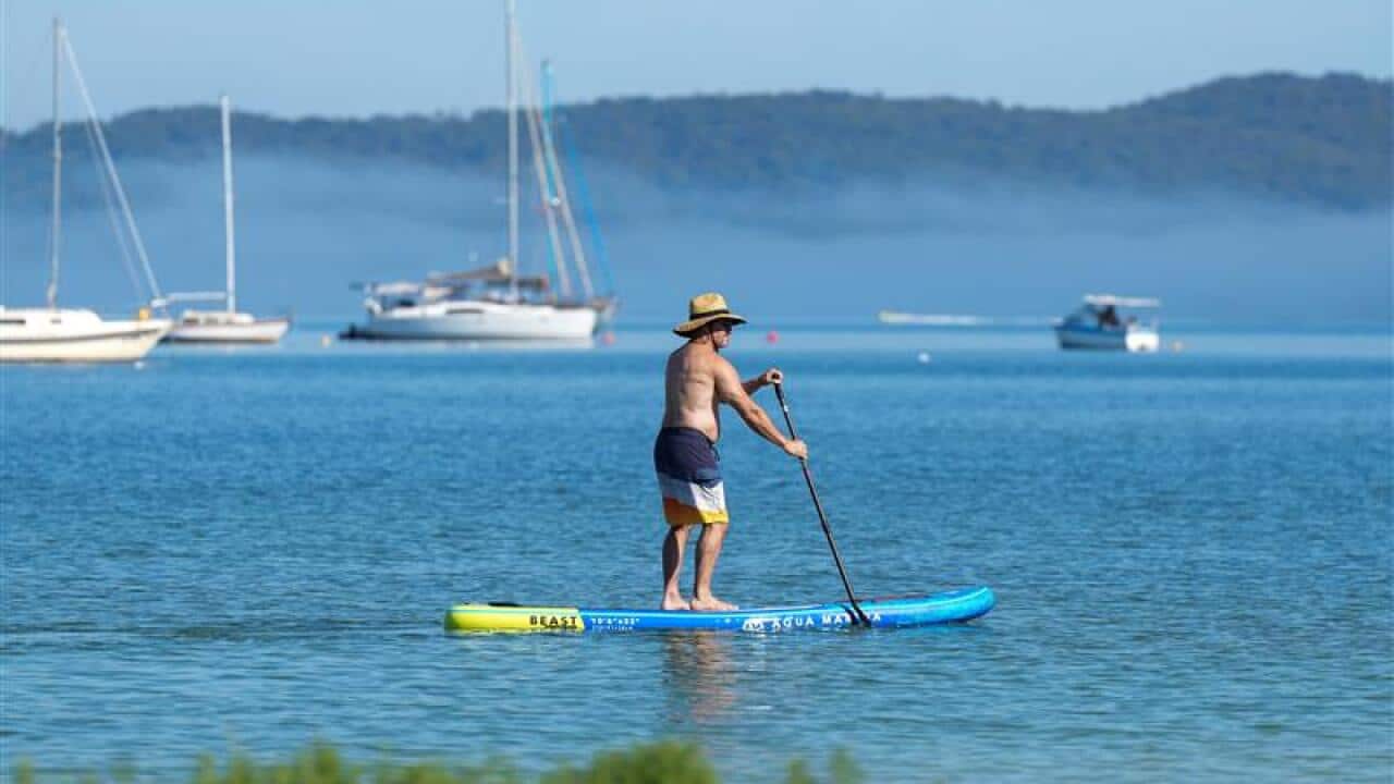 Beachgoers are seen at Bondi Beach in Sydney