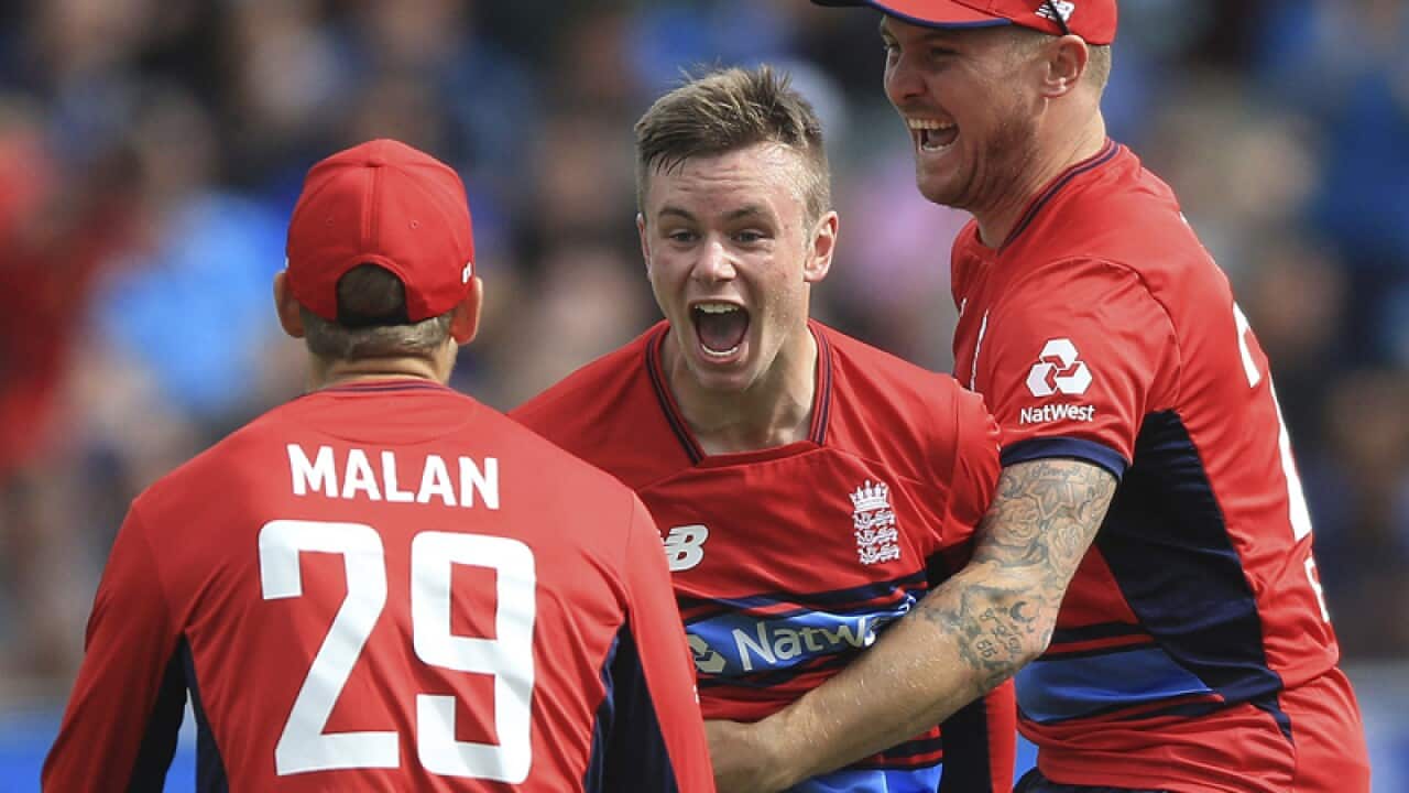 England's Mason Crane celebrates after claiming a wicket
