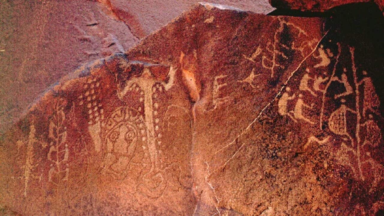 Ancient Aborignal rock art coined ‘Climbing Men Panel’ found amongst thousands of drawings and carvings near the Burrup Peninsula in Western Australia.