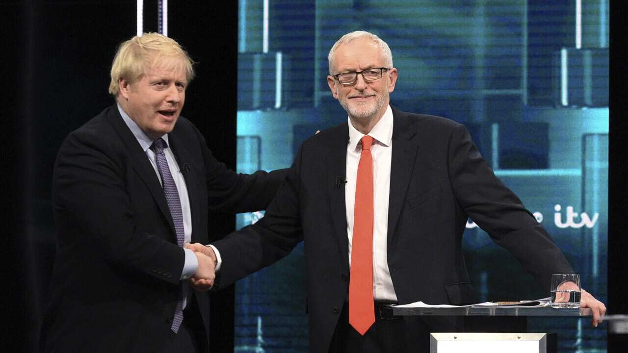 Boris Johnson and Jeremy Corbyn shaking hands during a head-to-head debate last month.