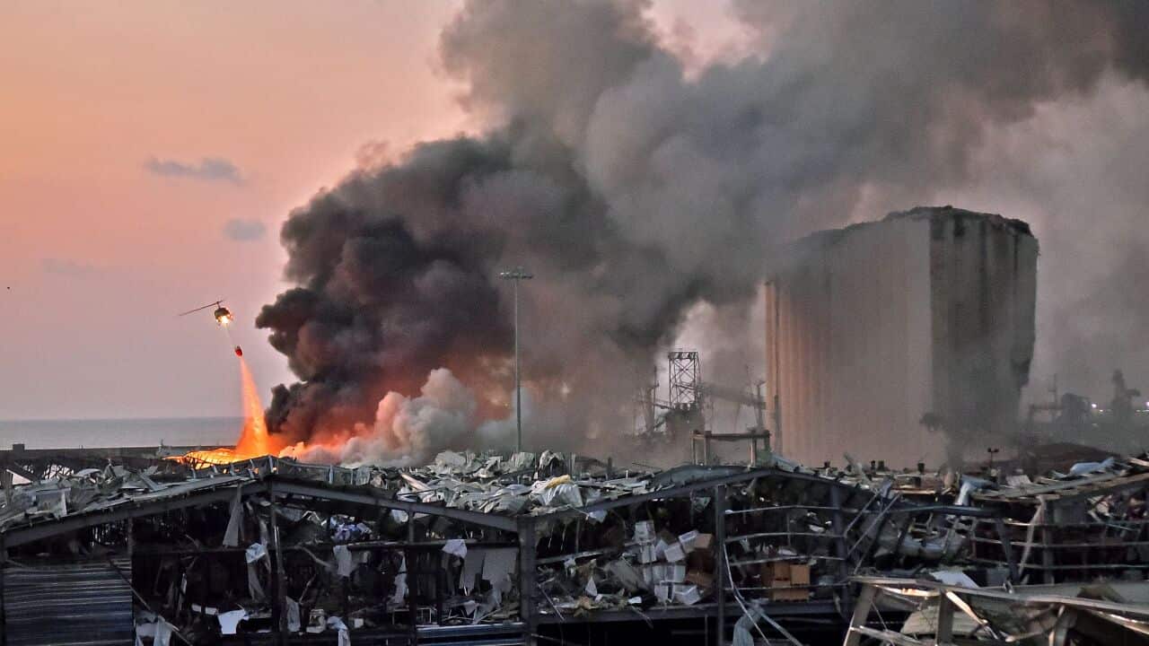 A helicopter at the scene of an explosion at the port of Lebanon's capital Beirut. 