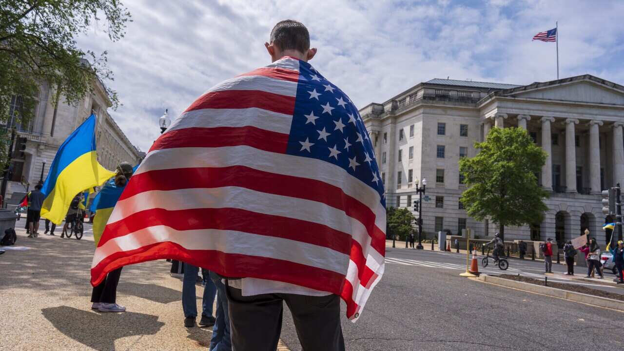Activists supporting Ukraine demonstrate outside the Capitol in Washington, Saturday, April 20, 2024,