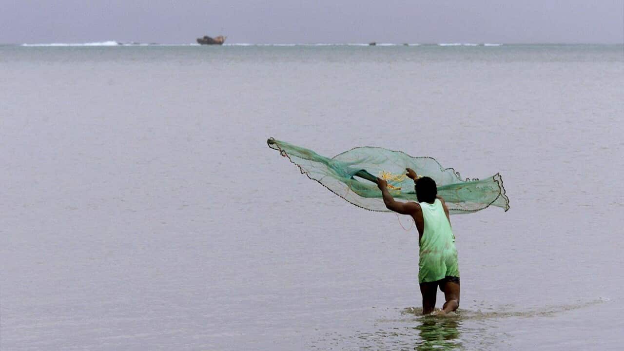 A fisherman off the coast Suva, Fiji.