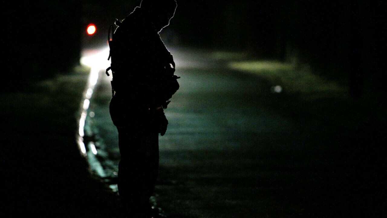 A French police officer stands at a check point