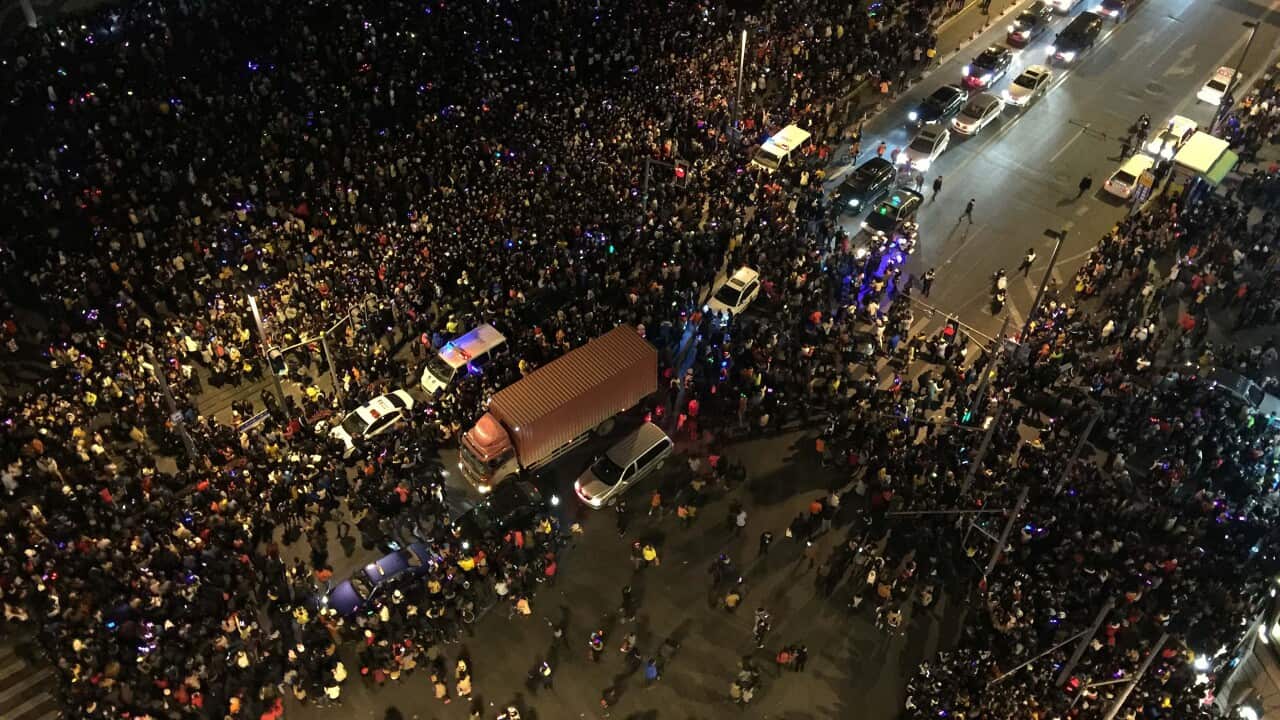 This overhead view shows emergency vehicles amongst the crowd after a stampede by new year's revellers in Shanghai's historic riverfront in Shanghai on January 1, 2015. (Getty)