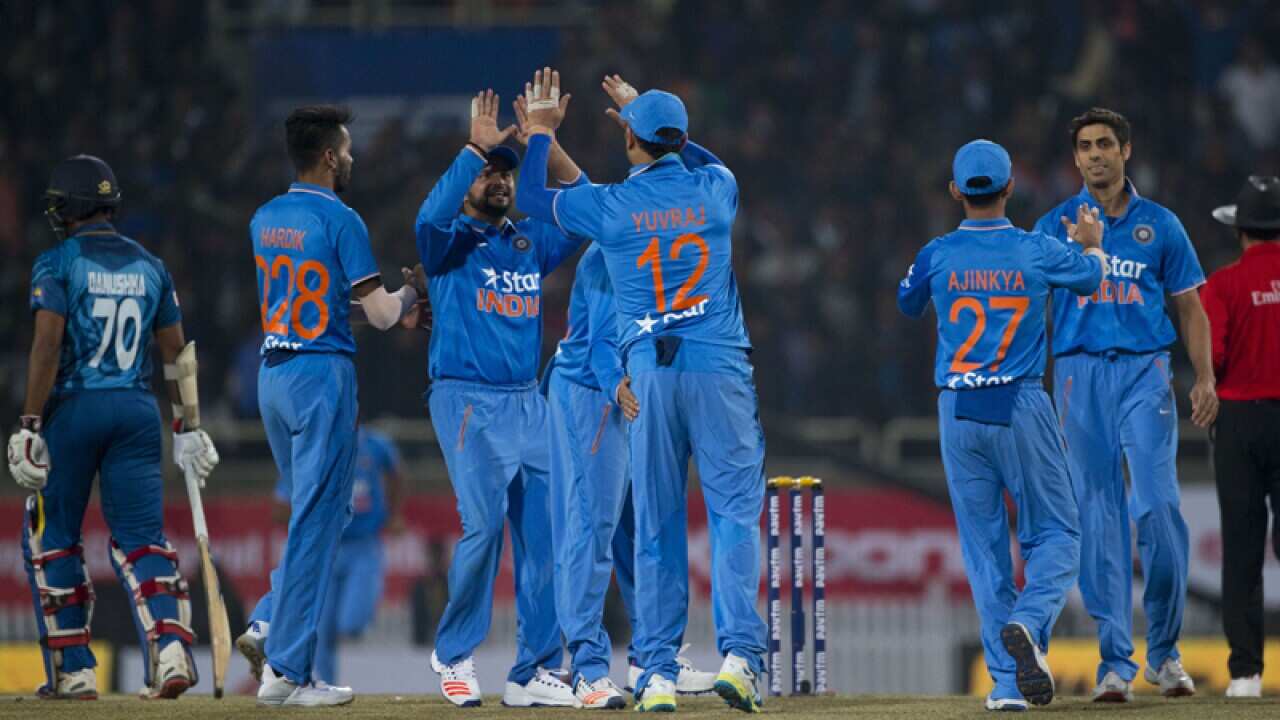 Indian cricketers celebrate.