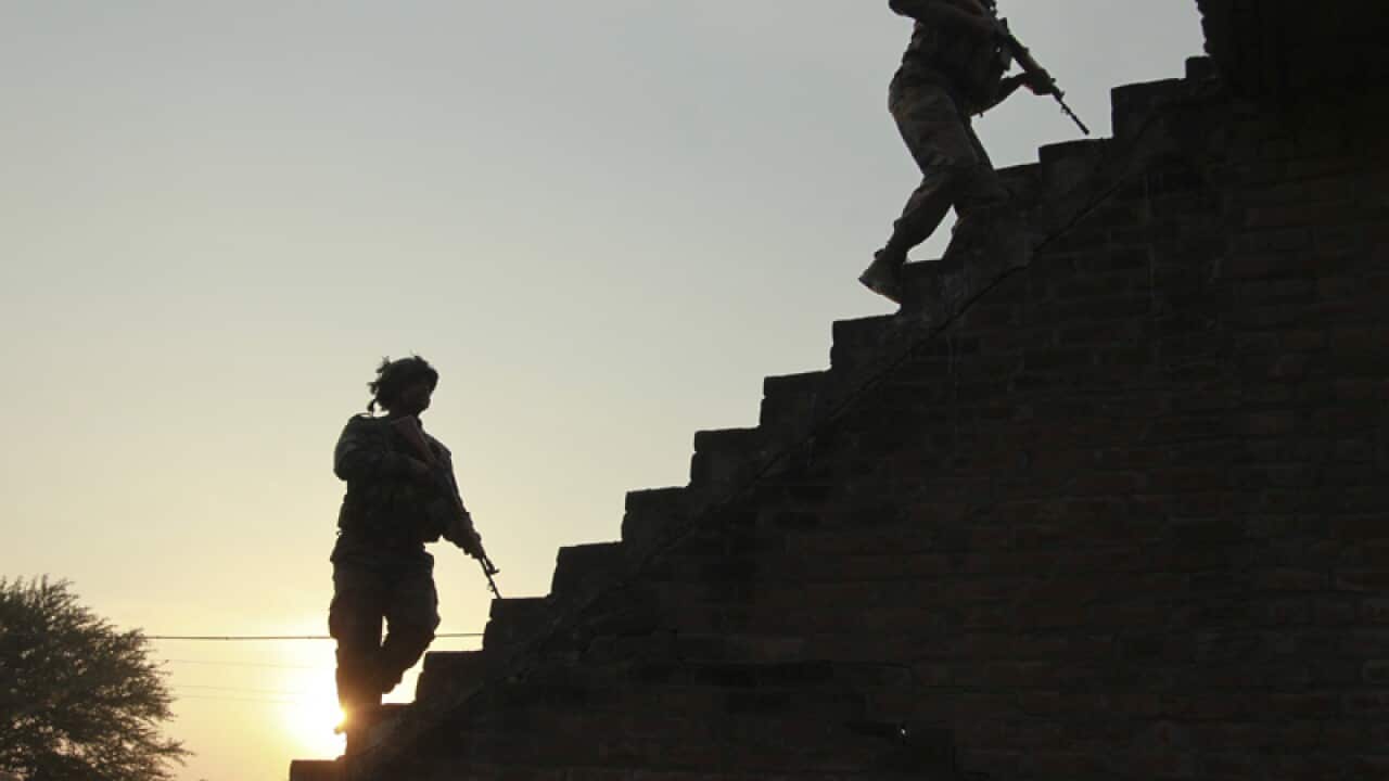 Indian soldiers outside the Indian air force base in Pathankot