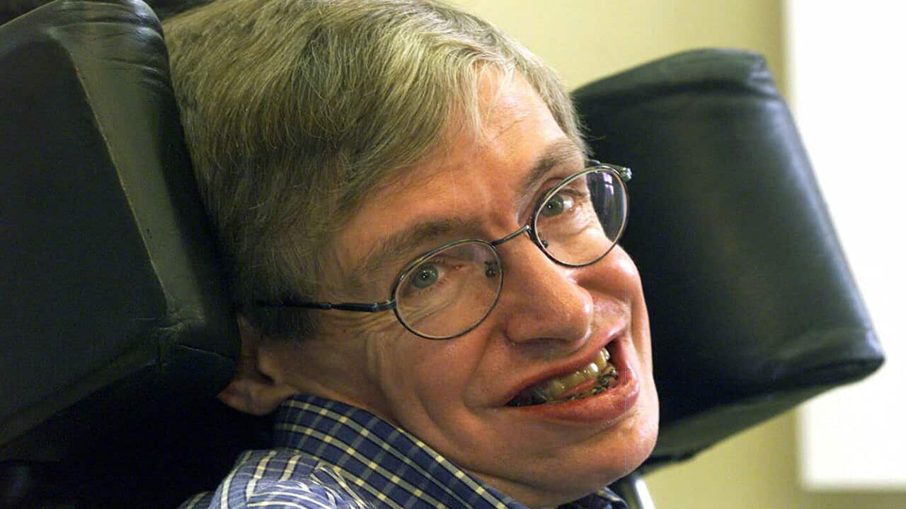A 1999 file photo of Professor Stephen Hawking smiling during a news conference at the University of Potsdam, near Berlin.