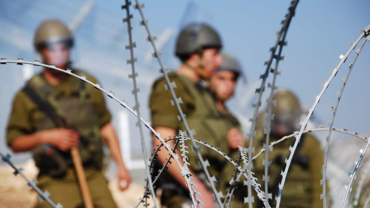 Razor Wire and Soldiers