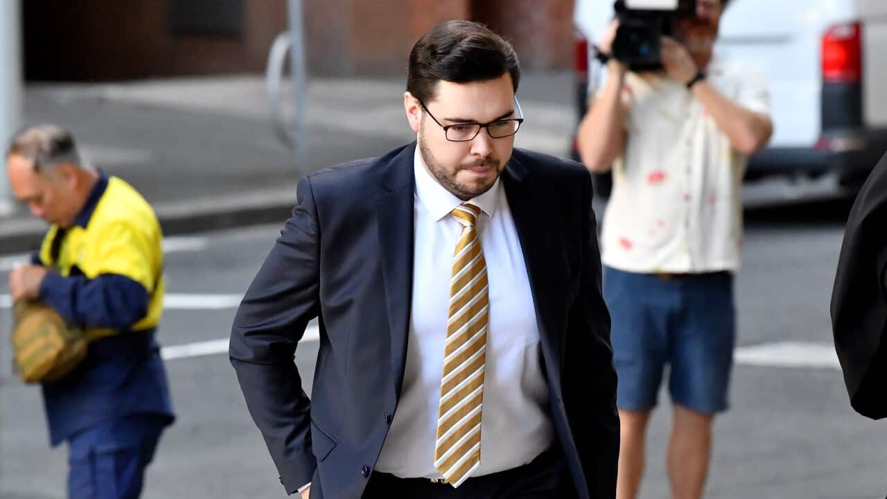 Bruce Lehrmann walking down a street.