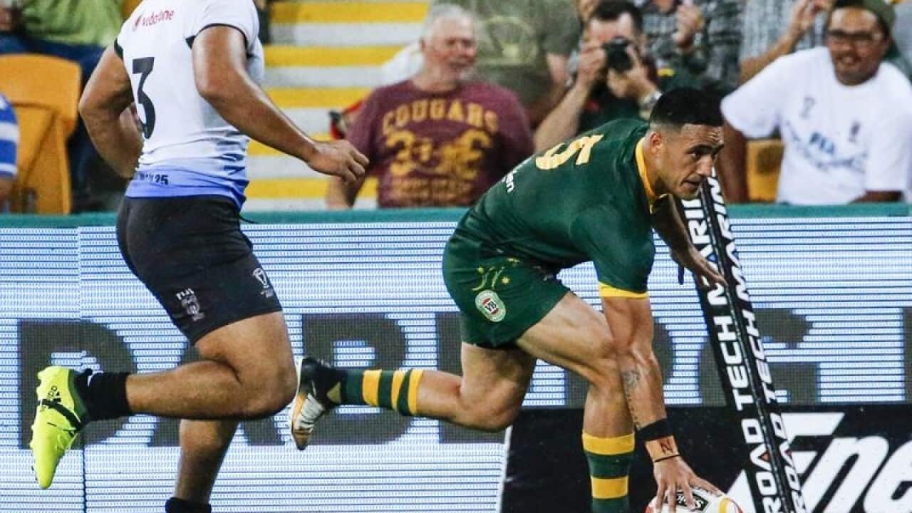 Valentine Holmes of the Kangaroos scores a record breaking try.