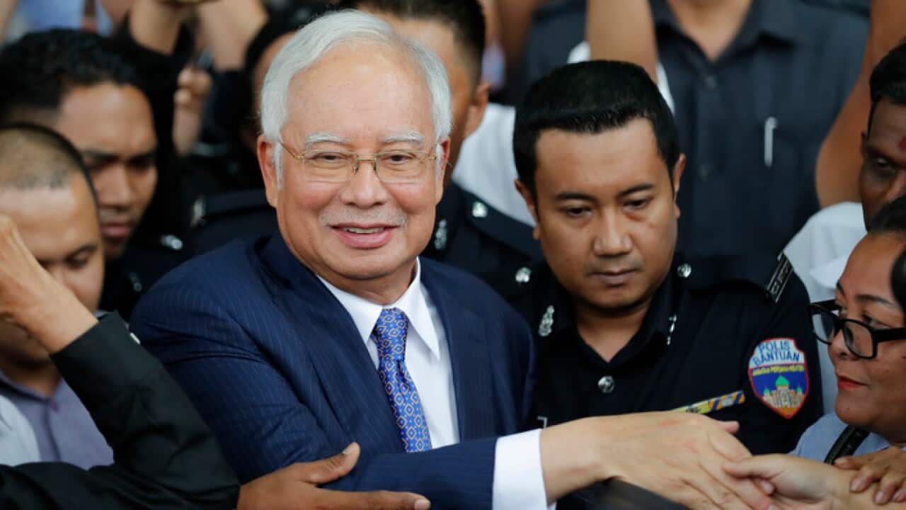 Former Prime Minister Najib Razak leaves after his court appearance at the Kuala Lumpur High Court