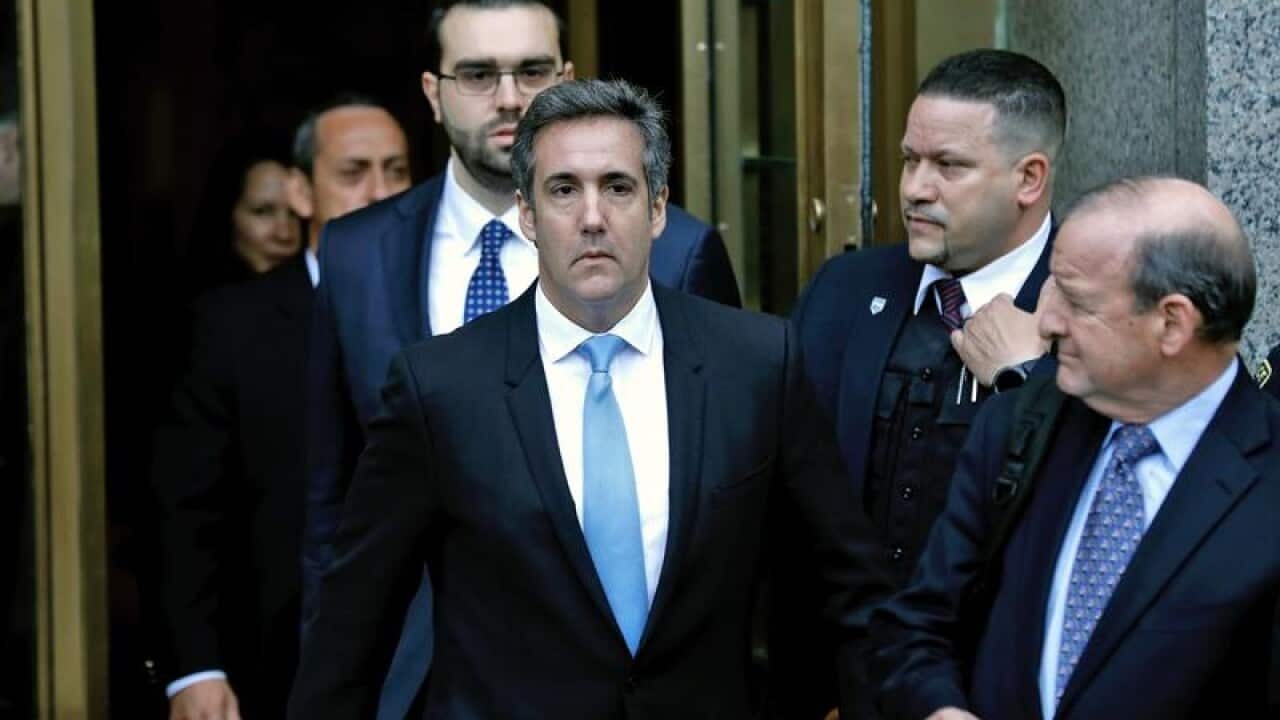 Michael Cohen leaves court after the hearing