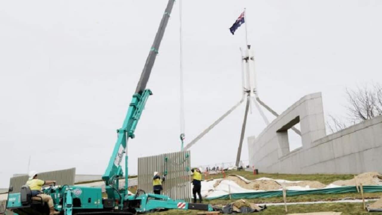 A security fence is installed across the lawns of Parliament House in Canberra on Tuesday 12 September 2017.