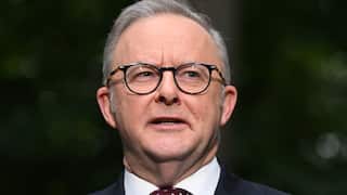 Anthony Albanese speaking while standing outside.