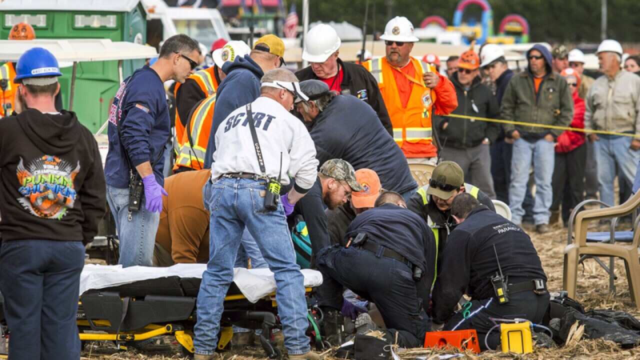 Paramedics tend to a person who was injured in Delaware