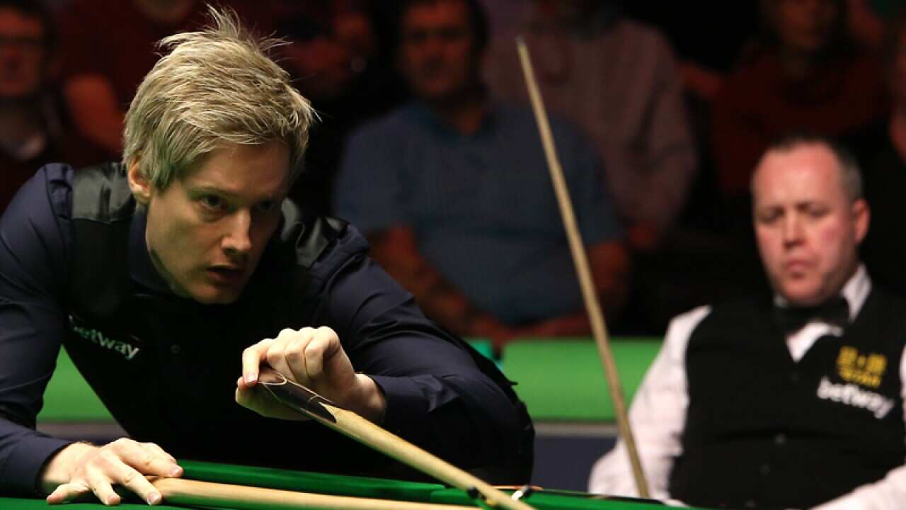 Neil Robertson in action against John Higgins.