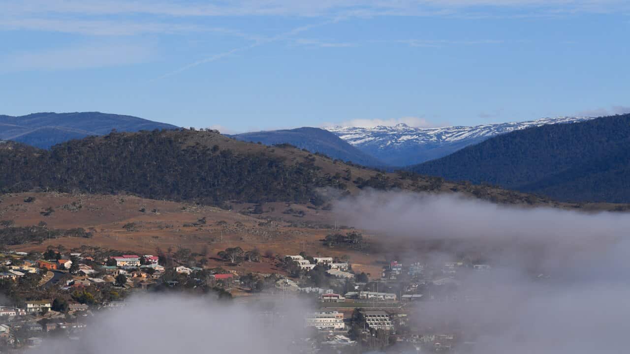 Early morning fog lays over Jindabyne in NSW, Friday, June 19, 2020. Thredbo Ski resort is expected to open on June 22, while Perisher Ski resort will open on June 24. (AAP Image/Lukas Coch) NO ARCHIVING
