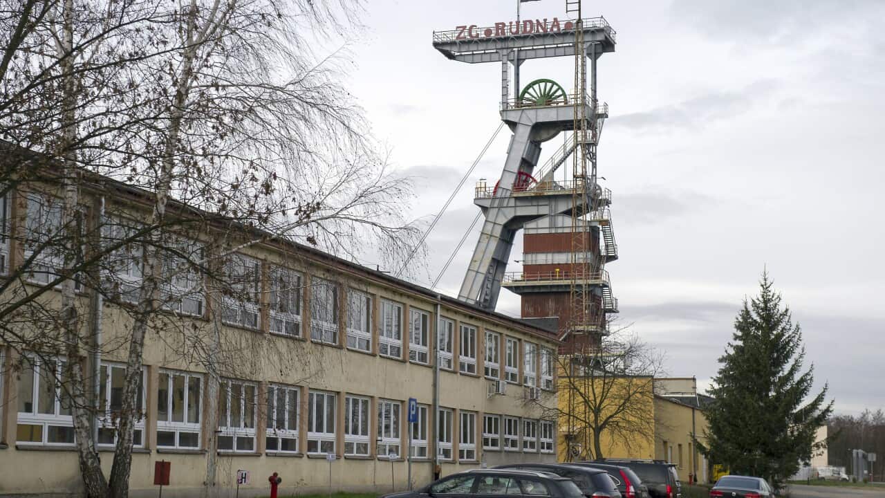 A view of the entrance to the Rudna copper mine with a miners flag at half-staff , in Polkowice, Poland, Wednesday, Nov. 30, 2016. The mine was hit by a tremor and cave-in, killing four miners and four are missing. (AP Photo/str)