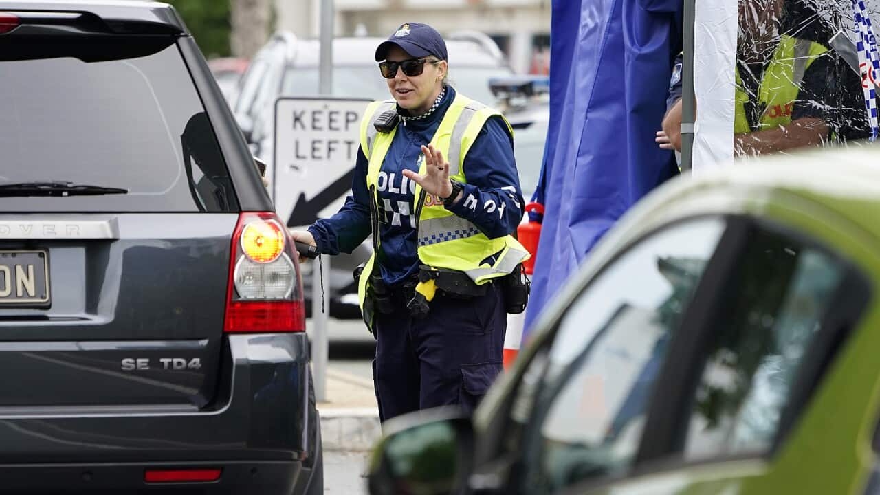 A Queensland police officer at a checkpoint at Coolangatta on the Queensland-New South Wales border