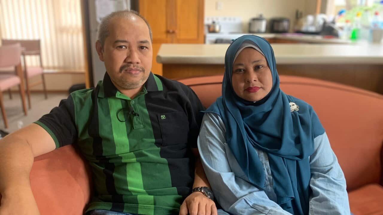 Nazril Omar (L) and wife Zurinawati Binti Mohi