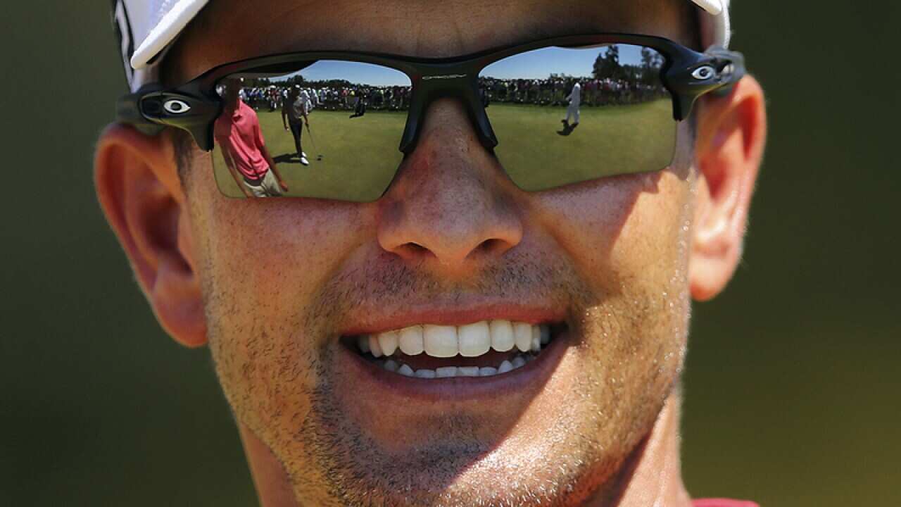 Adam Scott smiles during a practice round in Augusta