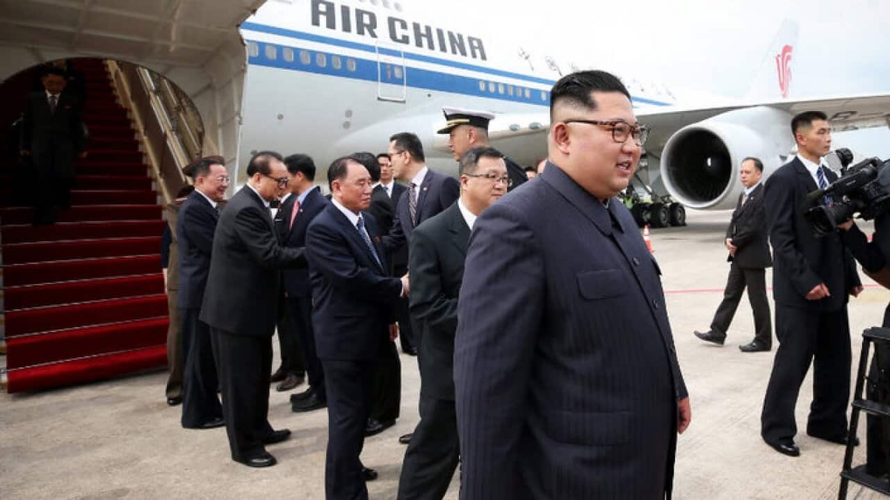 North Korean leader Kim Jong-un (C) as he arrives at Changi Airport in Singapore, 10 Jun 2018.