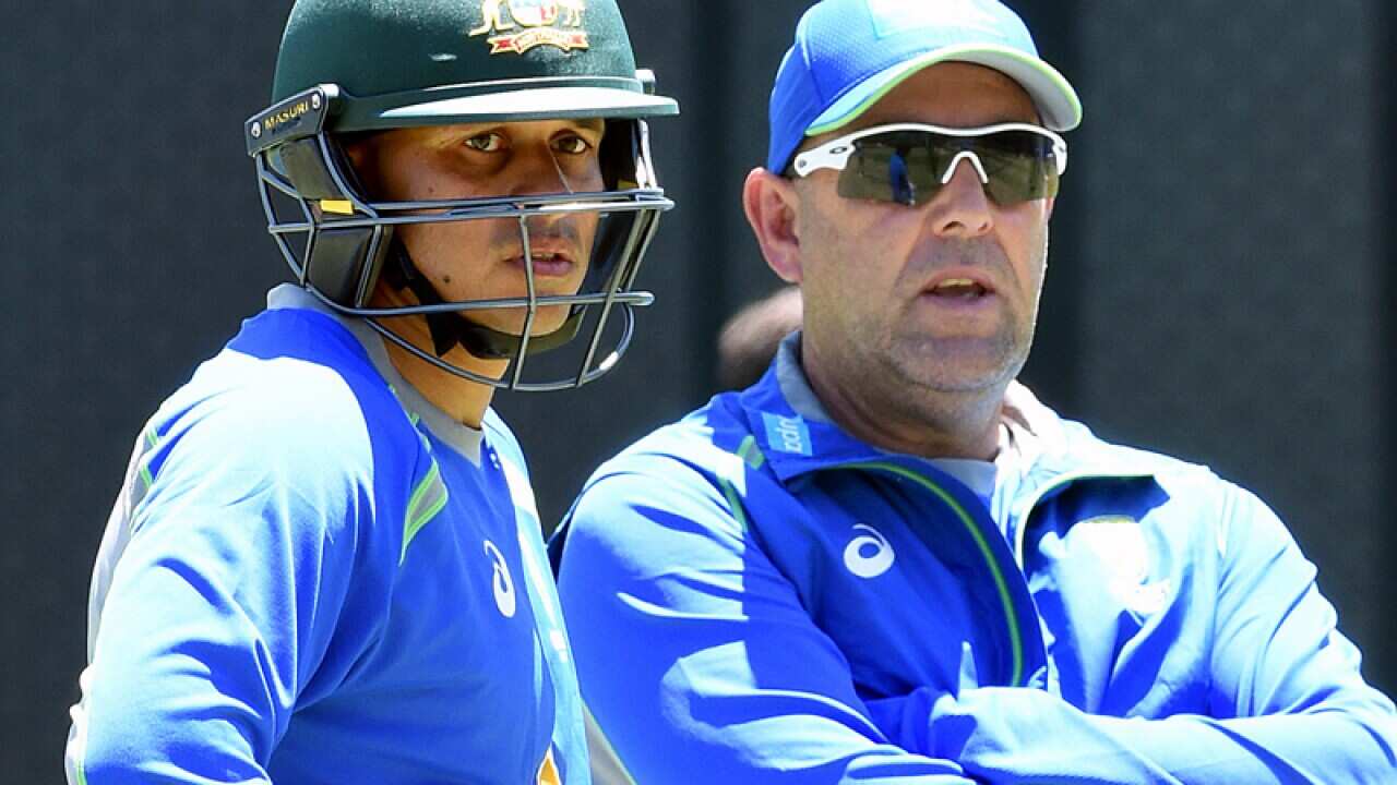 Usman Khawaja (L) and coach Darren Lehmann