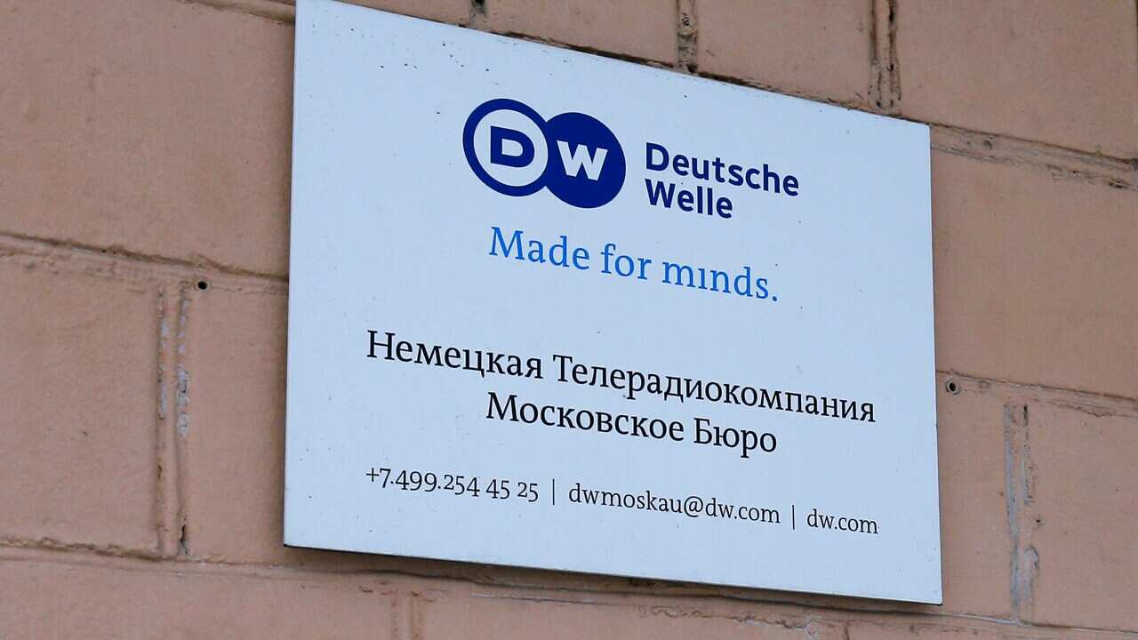 The sign of the Moscow office of German public broadcaster Deutsche Welle is seen on the wall of the apartment building in Moscow, Russia, Friday, Feb. 4, 2022. Russia's Foreign Ministry says it is shutting down the Moscow office of German public broadcas