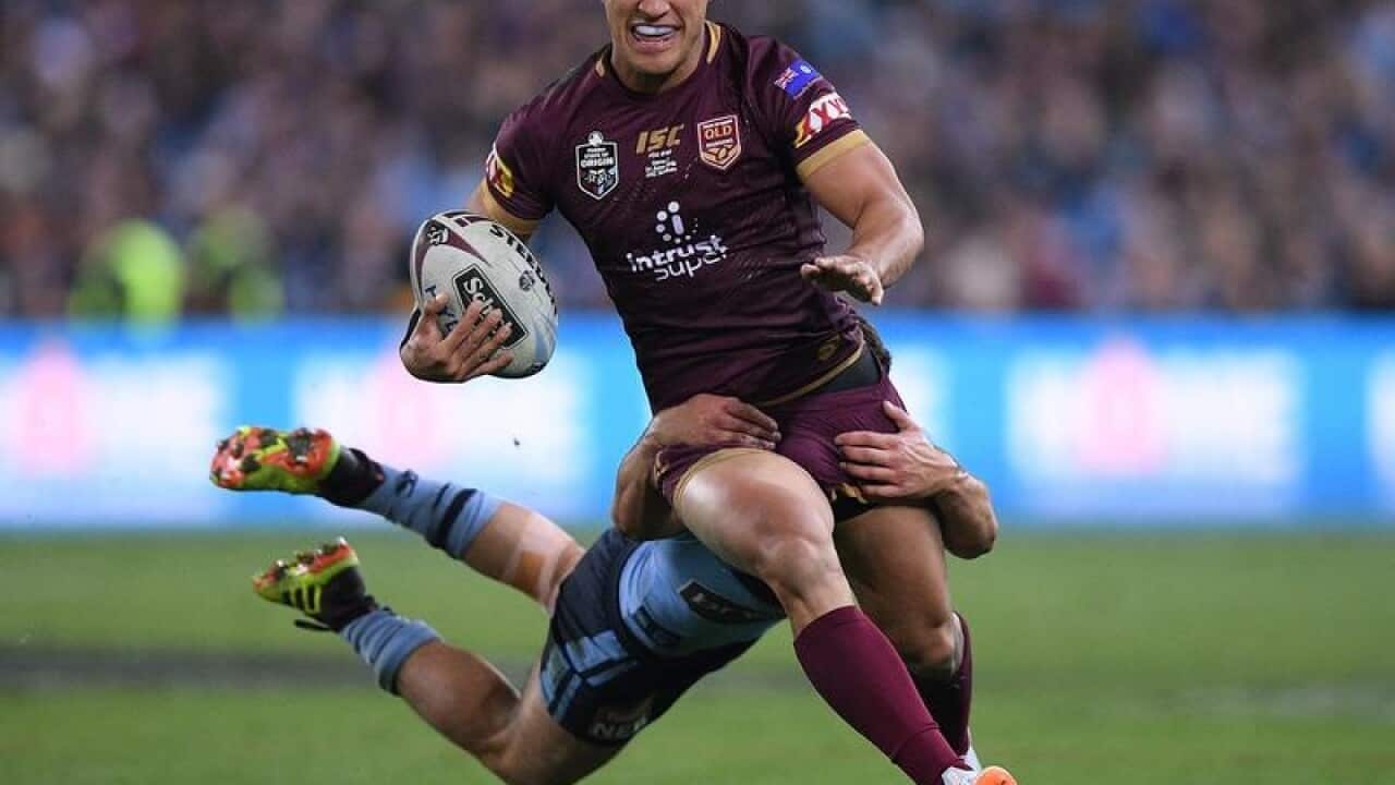 Nathan Cleary tackles Valentine Holmes