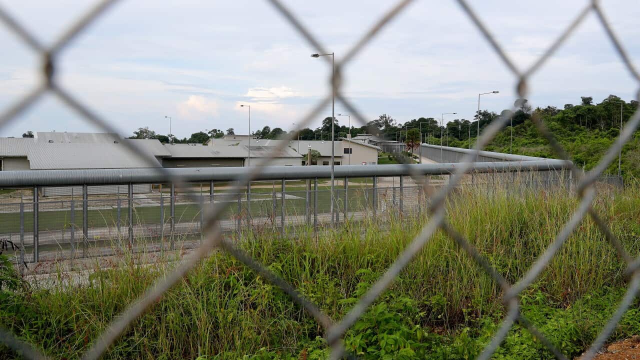Christmas Island detention centre seen through a fence.
