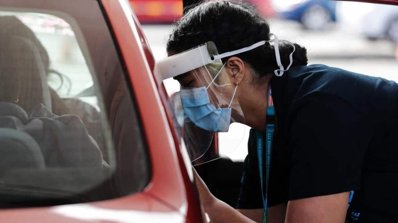 A nurse takes a COVID-19 swabs in NZ.