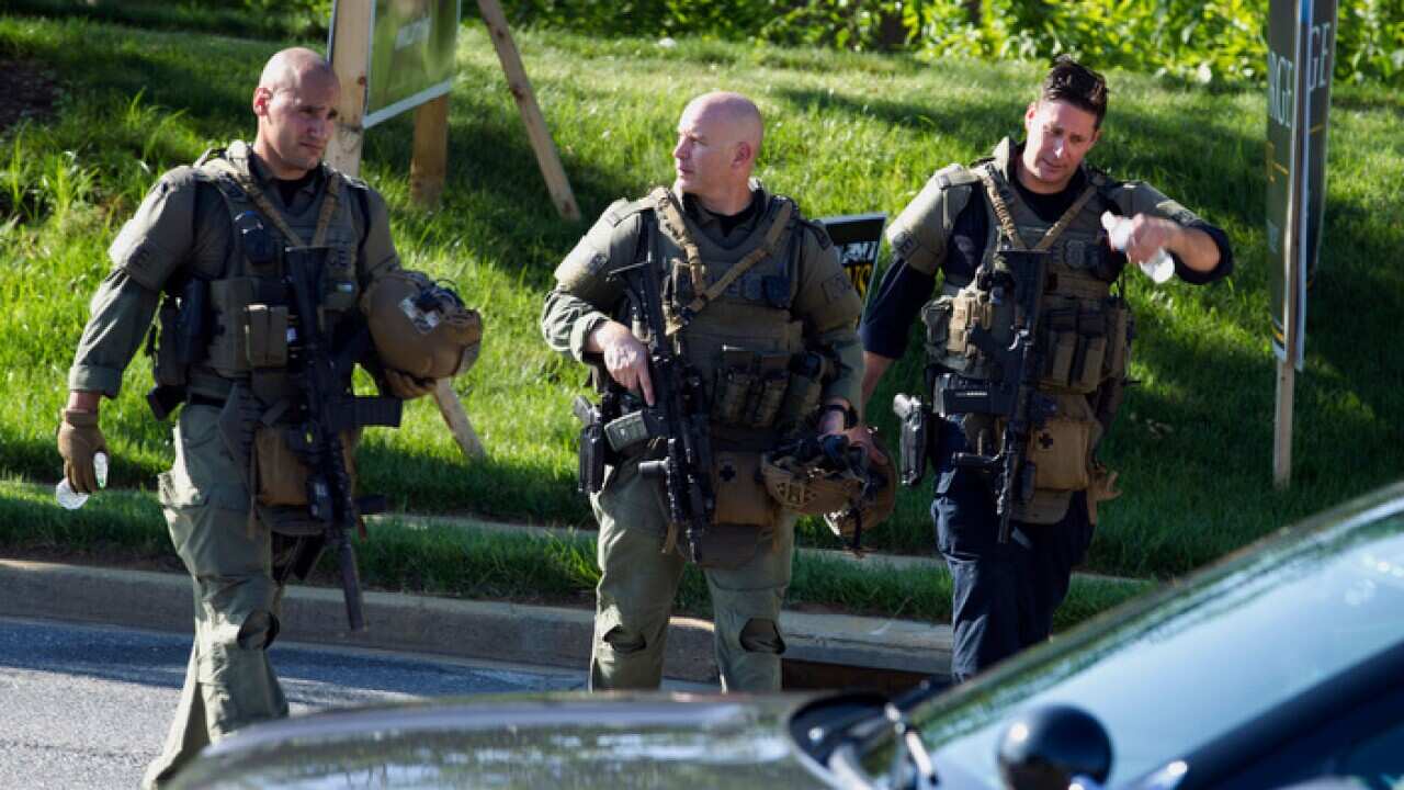 Maryland police officers patrol the scene of the shooting. 