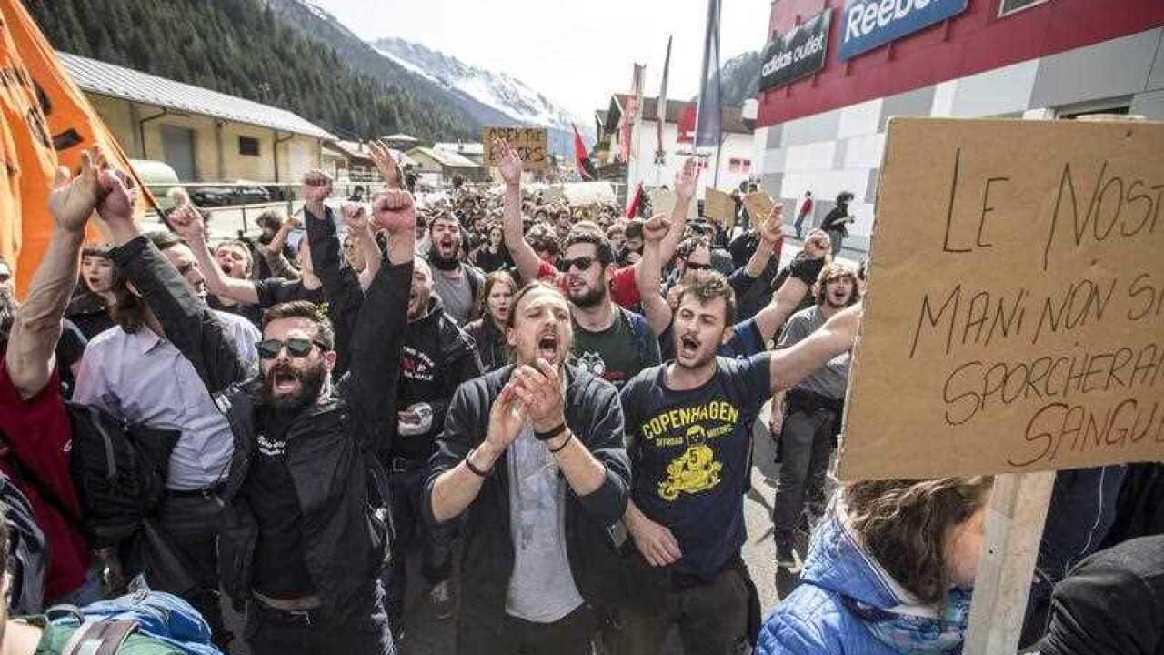 People demonstrate against the Austrian government's planned reintroduction of border controls at the Brennerpass, Austria, 03 April 2016.