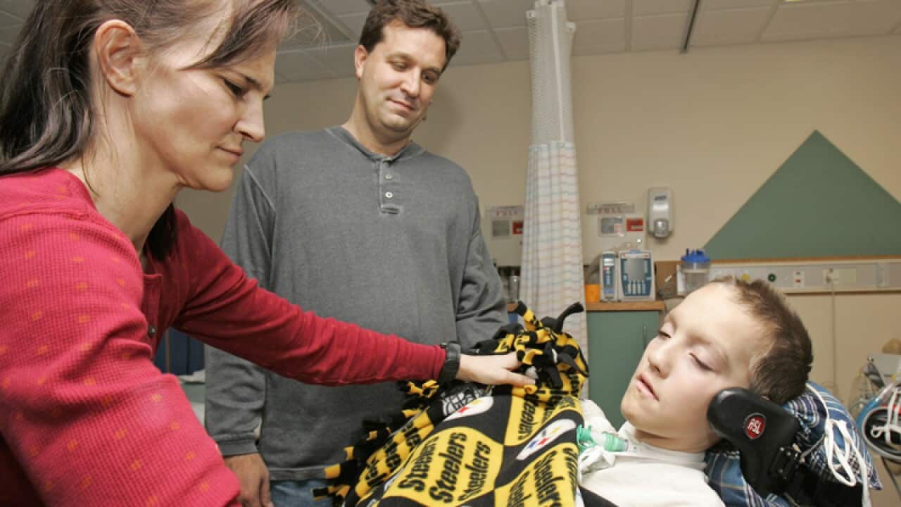 Alex Malarkey with his parents Beth and Kevin