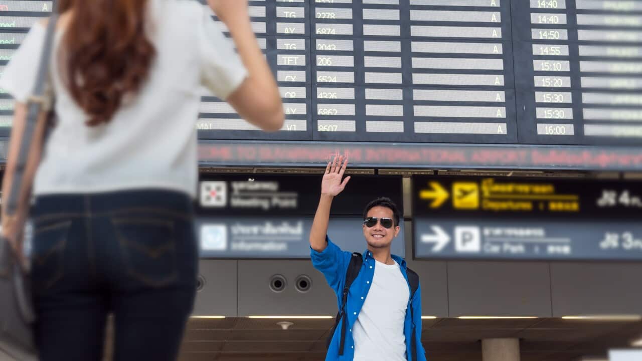 Asian couple traveler with suitcases at the airport. Lover trave