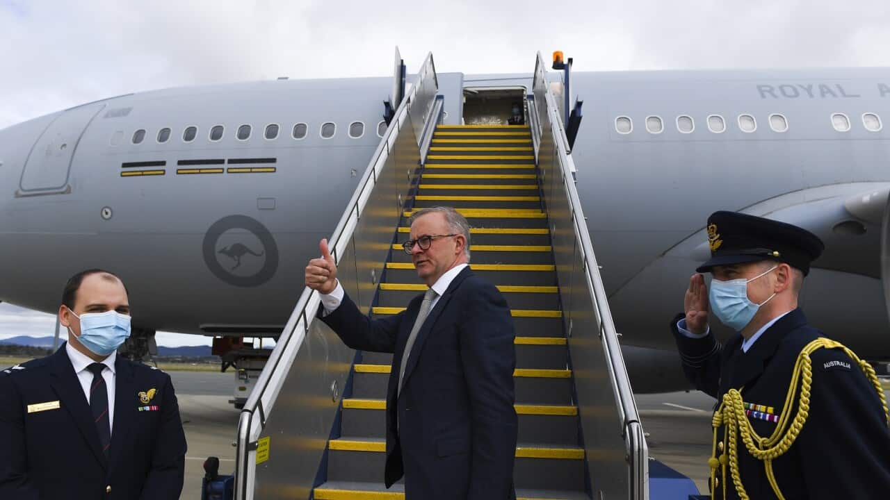 Prime Minister Anthony Albanese boards the plane to Japan to attend the QUAD leaders meeting in Tokyo