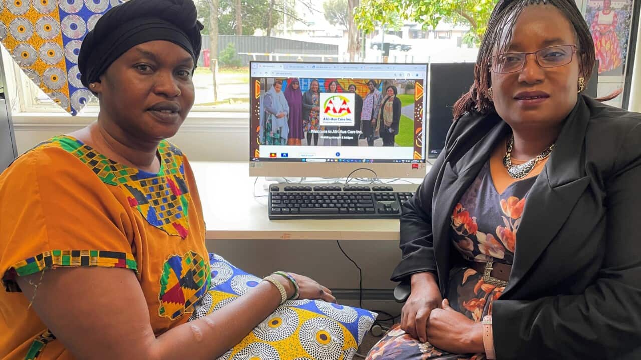 Nyaluet Yan (left) with Afri-AusCare founder Selba-Gondoza Luka.  (SBS-Sandra Fulloon).jpg