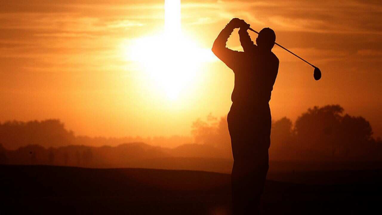 Man playing golf