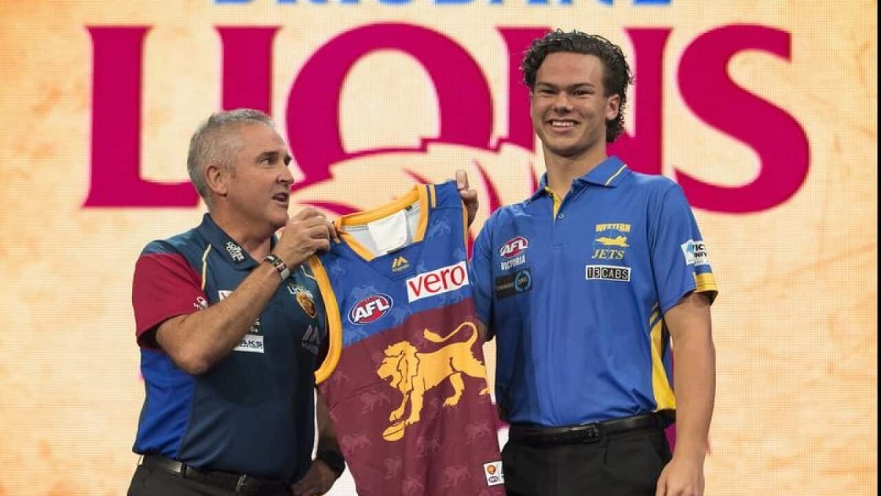Cameron Rayner (right) and Lions coach Chris Fagan.