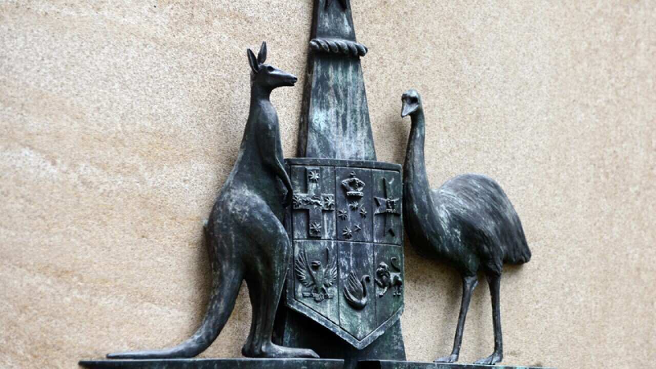 The Australian coat of arms outside a court building