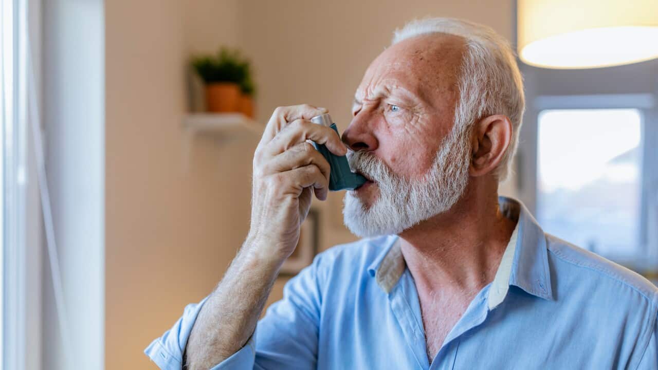 Old person with Inhaler