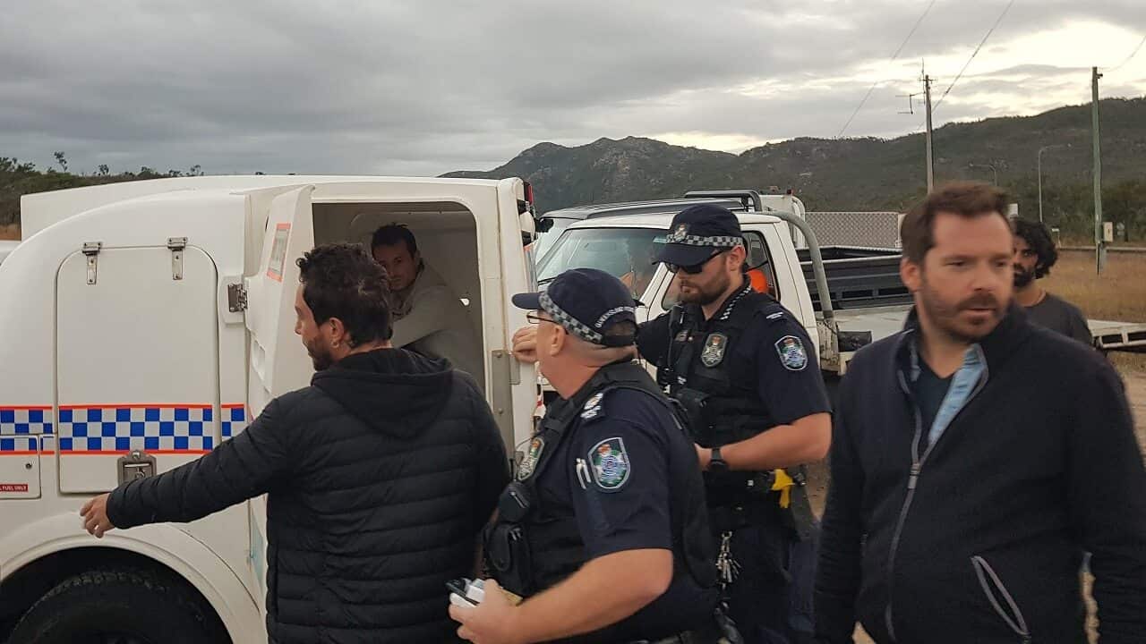 The French journalists being arrested.
